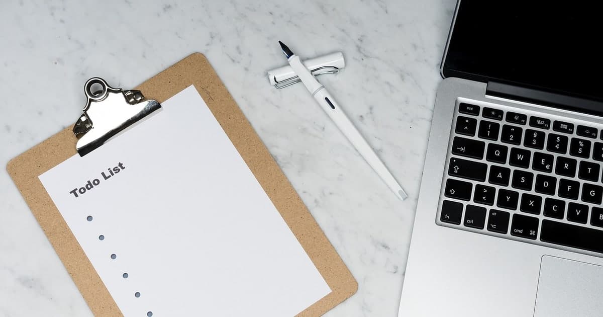 Laptop on desk representing better team task managers and Todoist alternatives in 2026
