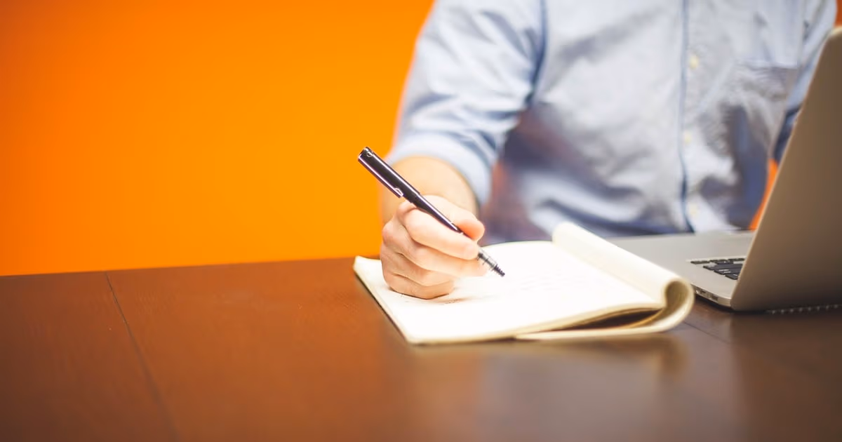 A solo business owner working at a laptop while an AI assistant handles leads, bookings, and follow-ups in the background