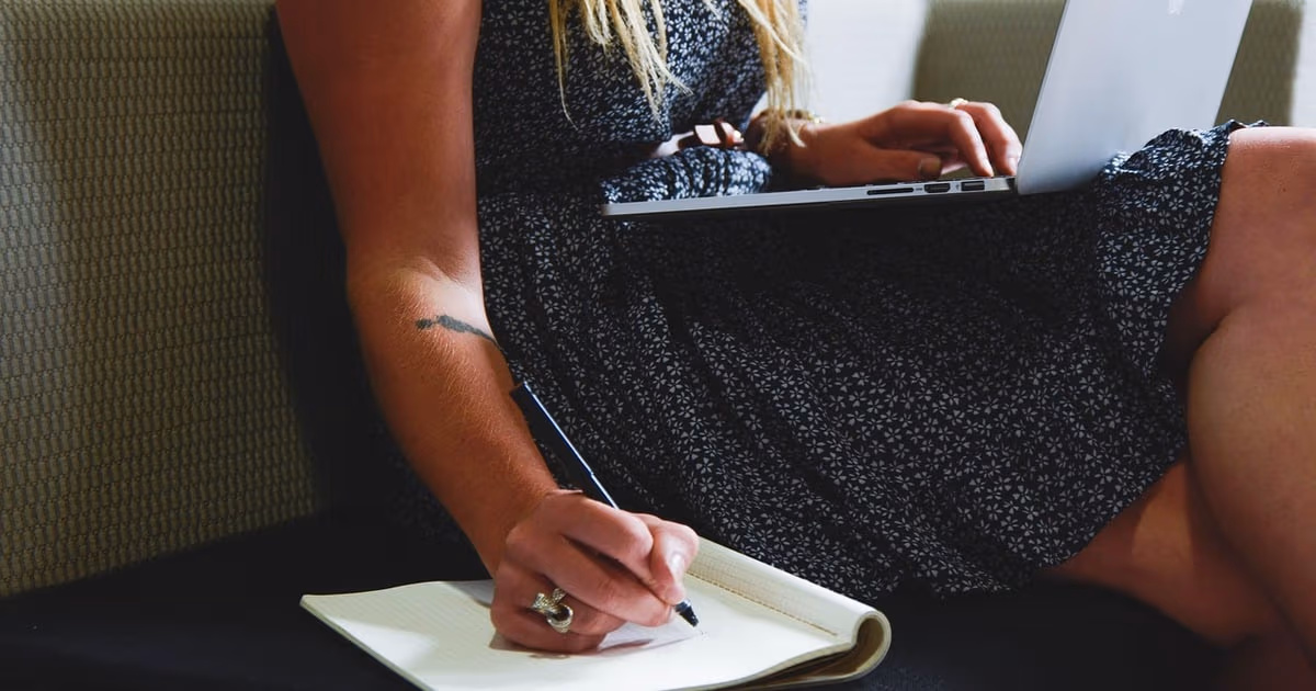 Solo founder at a desk running a one-person business with an AI-powered CRM in 2026