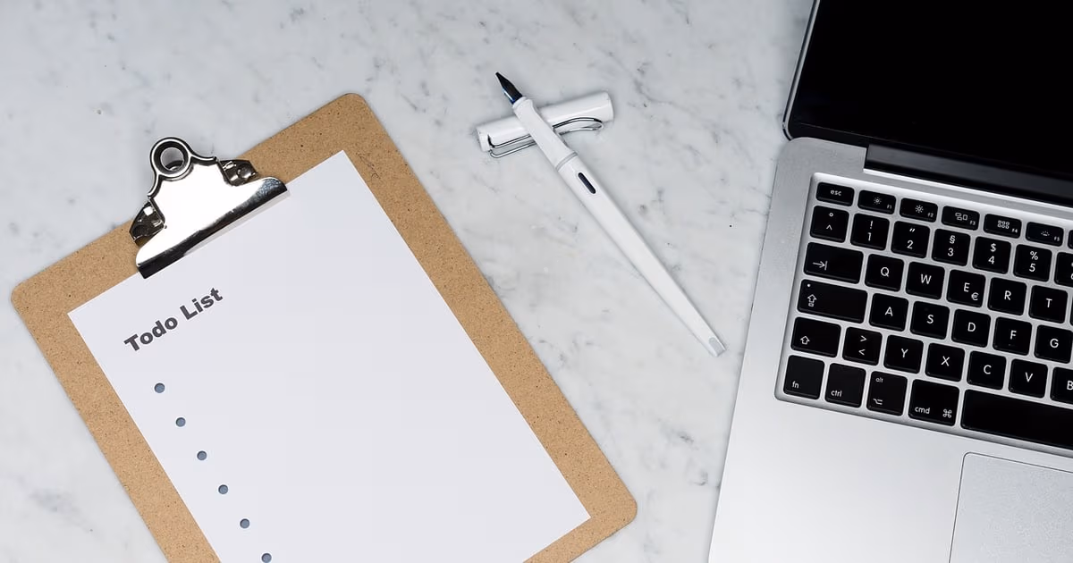 Laptop on desk representing better team task managers and Todoist alternatives in 2026