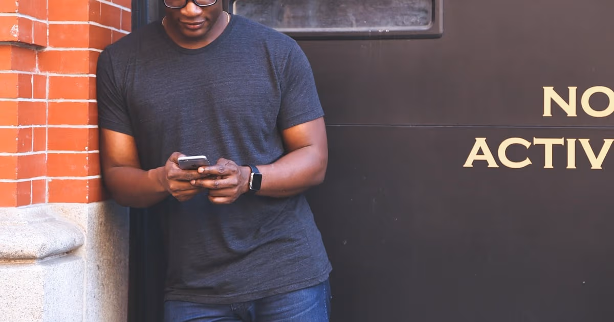 Business owner managing customer conversations and deals from WhatsApp on a smartphone