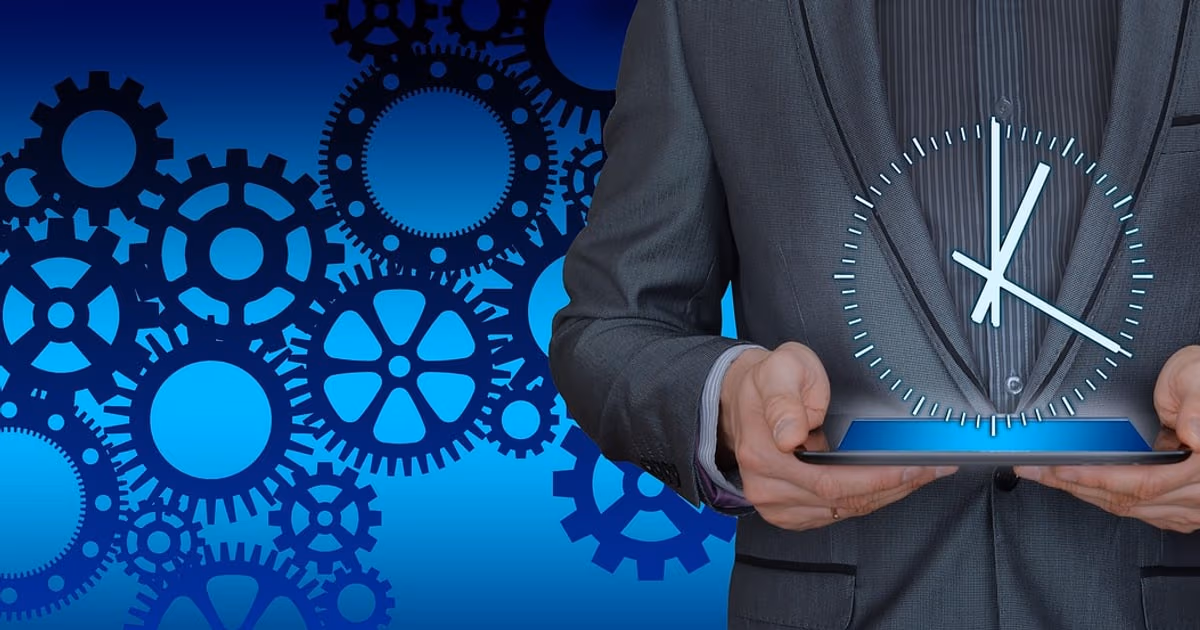 Person holding a tablet in front of interlocking gears, representing workflow automation software compared in 2026