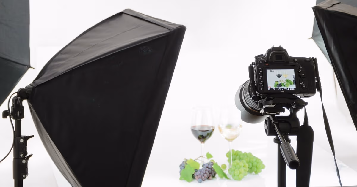 Photographer managing booking enquiries and shoot schedule on a laptop