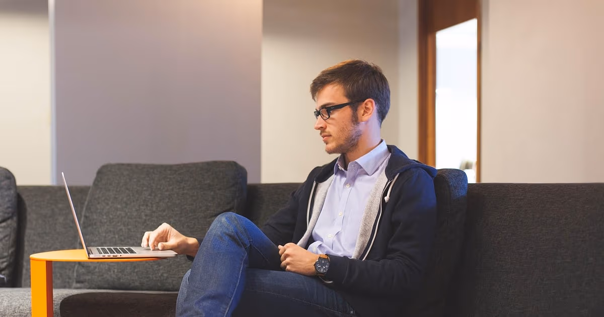 Small business owner running the business from a simple CRM on a laptop