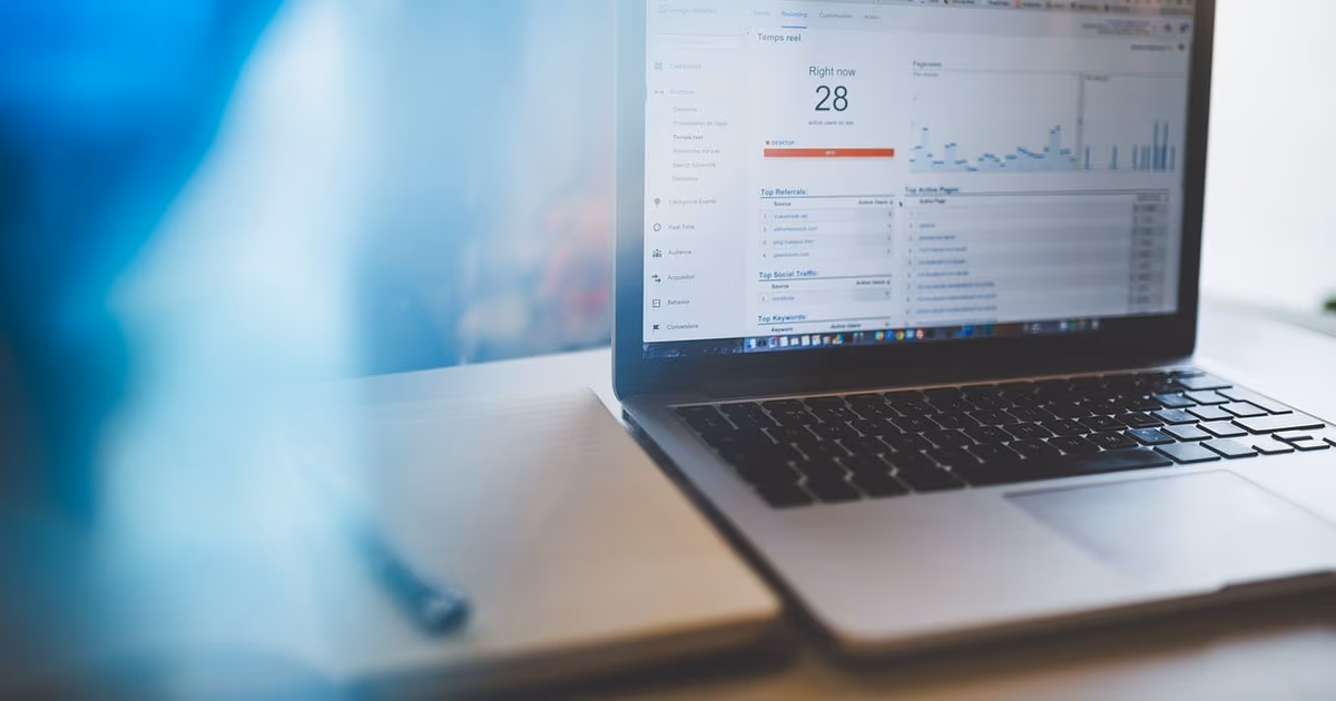 Person reviewing advertising performance on a laptop, representing Facebook lead ads flowing into a CRM