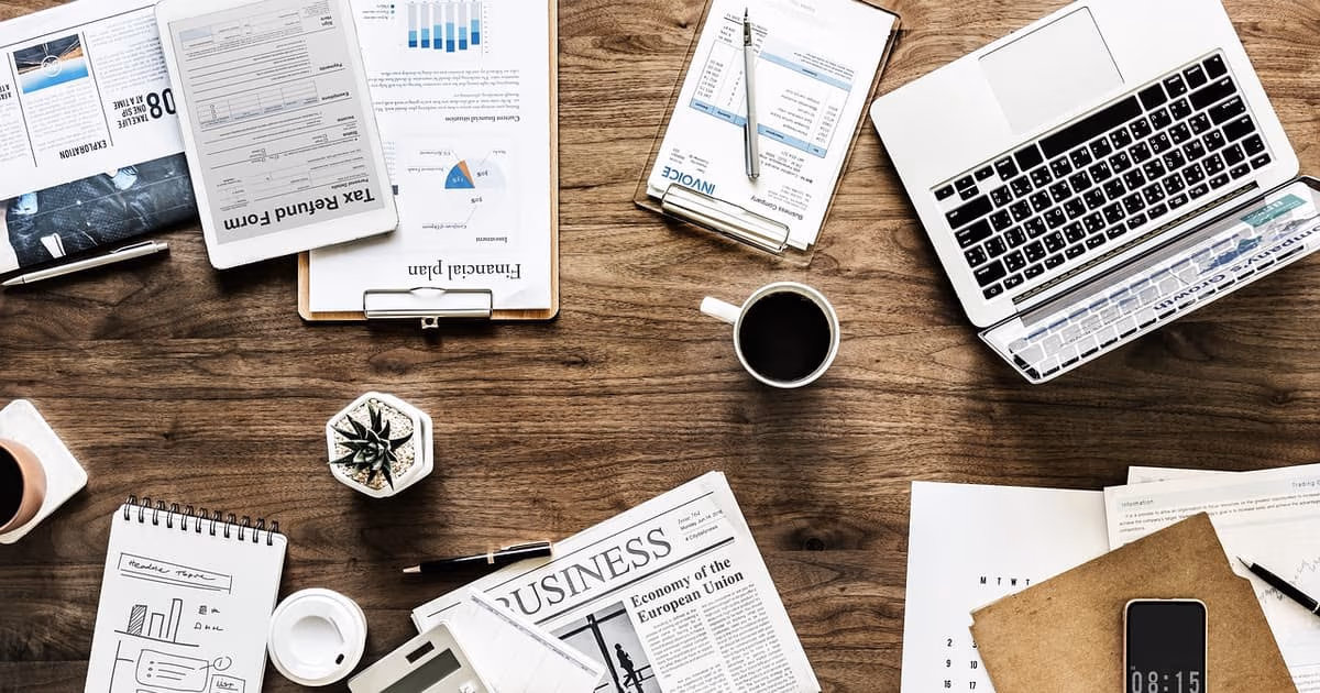 Small service business owner weighing GoHighLevel against simpler alternatives on a laptop
