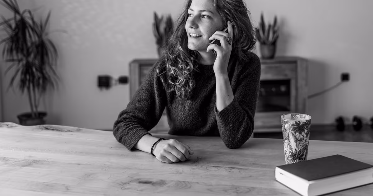 Small business owner selling on WhatsApp from a phone with an AI operator handling follow-ups