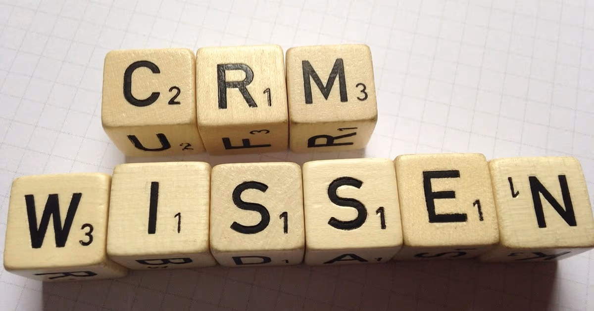 Laptop and phone representing WhatsApp CRM alternatives to Kommo in 2026