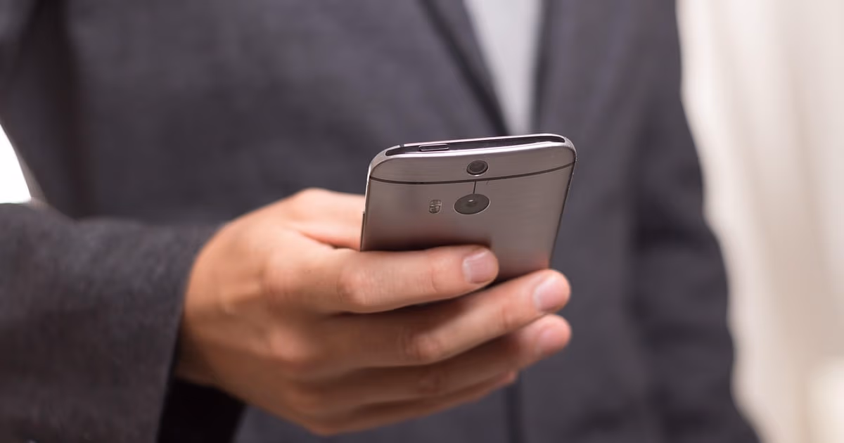 Small business owner managing customer conversations with WhatsApp CRM software in 2026
